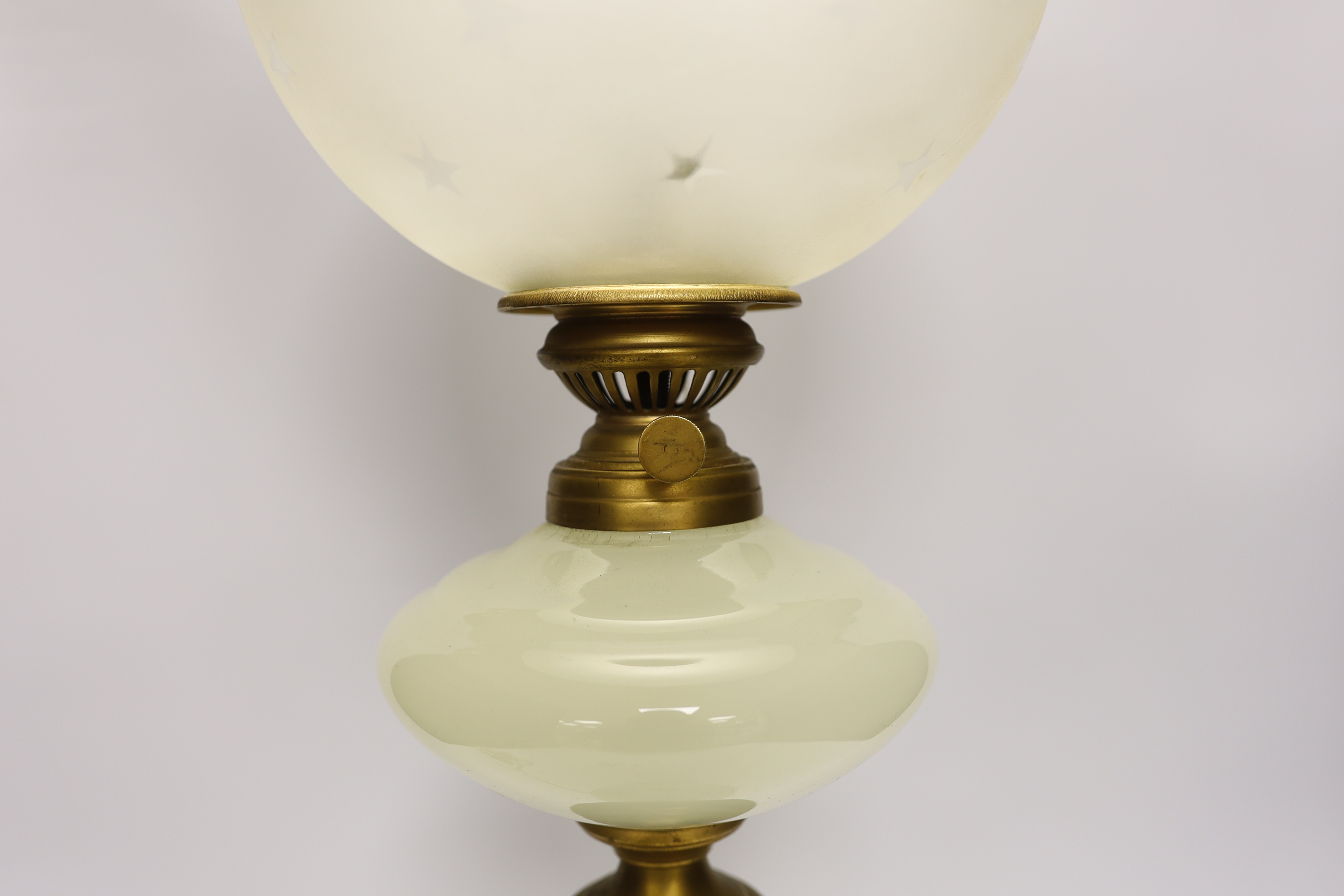 An opaque glass oil converted to a table lamp, 66cm high